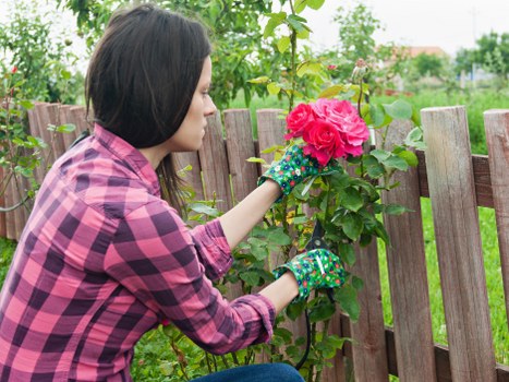 Gardener wearing PPE checking equipment