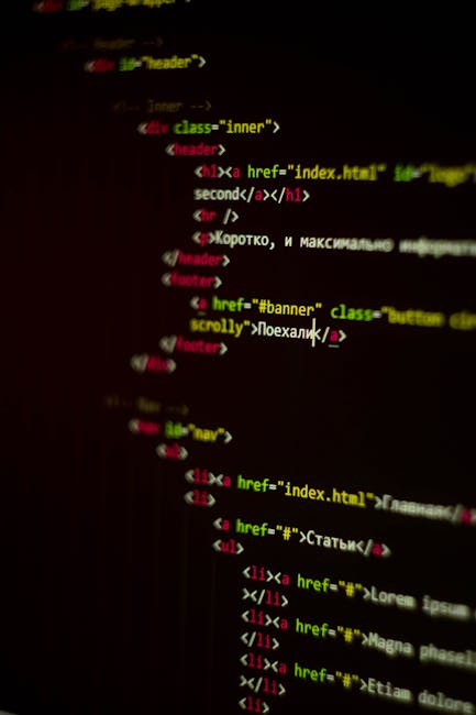 A close-up image of a computer screen displaying lines of colorful, blurred programming code on a dark background, with syntax highlighted in green, orange, blue, and purple. The code appears to be pa